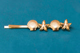 horquilla estrella/concha