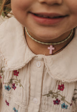 Colgante elástico cruz