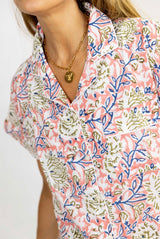 Pijama corto rosa flores blancas