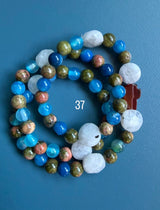 Rosario pulsera collar piedra niño