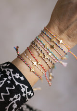 Pulsera cuerda cruz colores