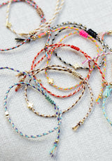 Pulsera cuerda cruz colores