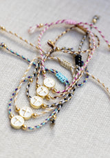 Pulsera cruz esmalte blanco